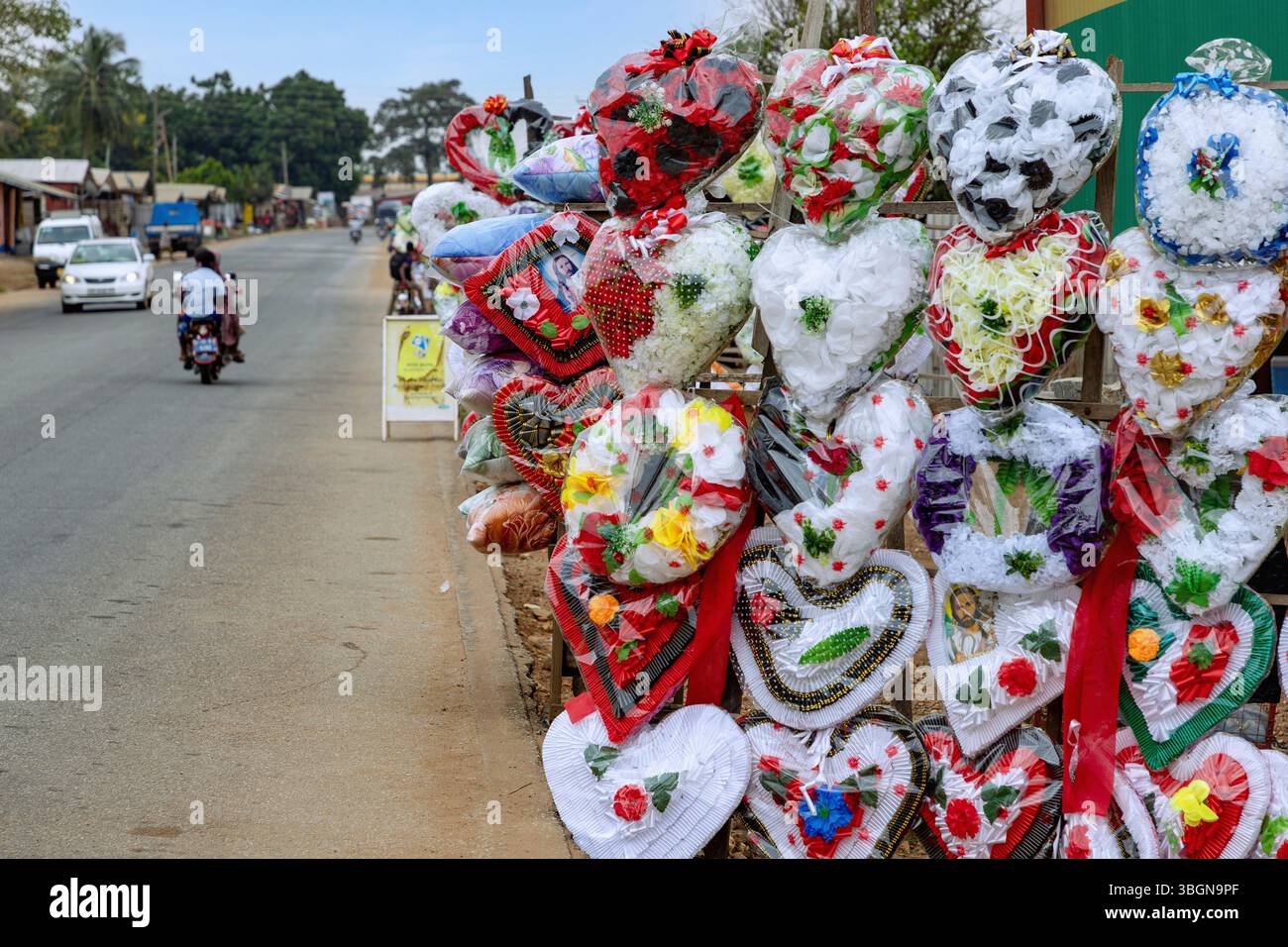 Funeral wreaths displayed for sale along the main road in Juapong in the Volta region of eastern Ghana in West Africa Stock Photo