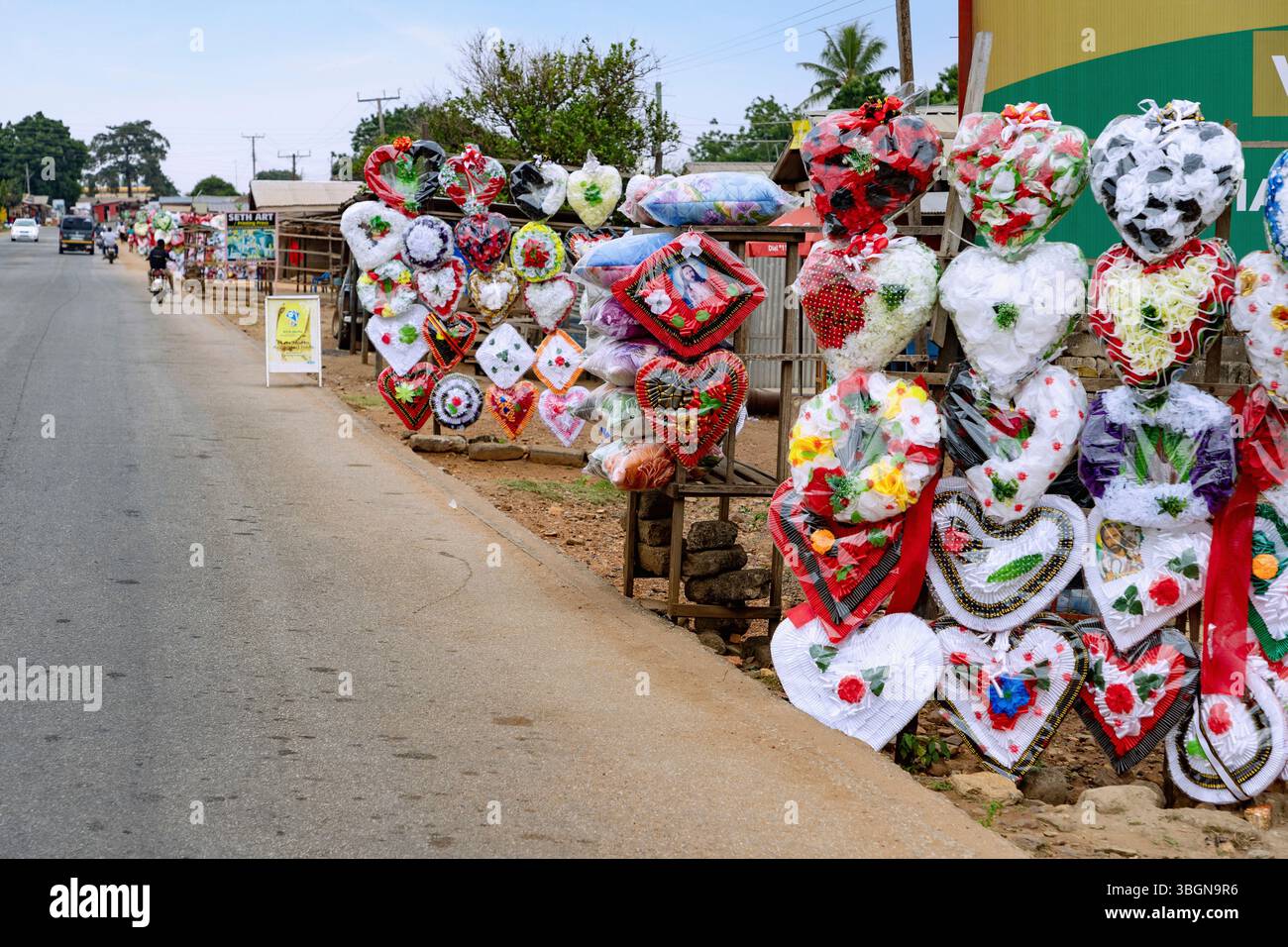 Funeral wreaths displayed for sale along the main road in Juapong in the Volta region of eastern Ghana in West Africa Stock Photo