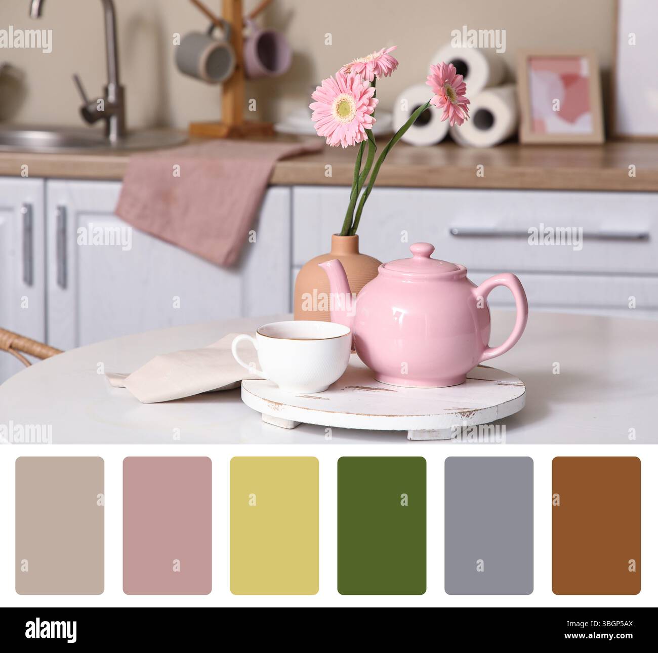 Pink teapot with cup of tea and beautiful on table in kitchen. Different color patterns Stock Photo