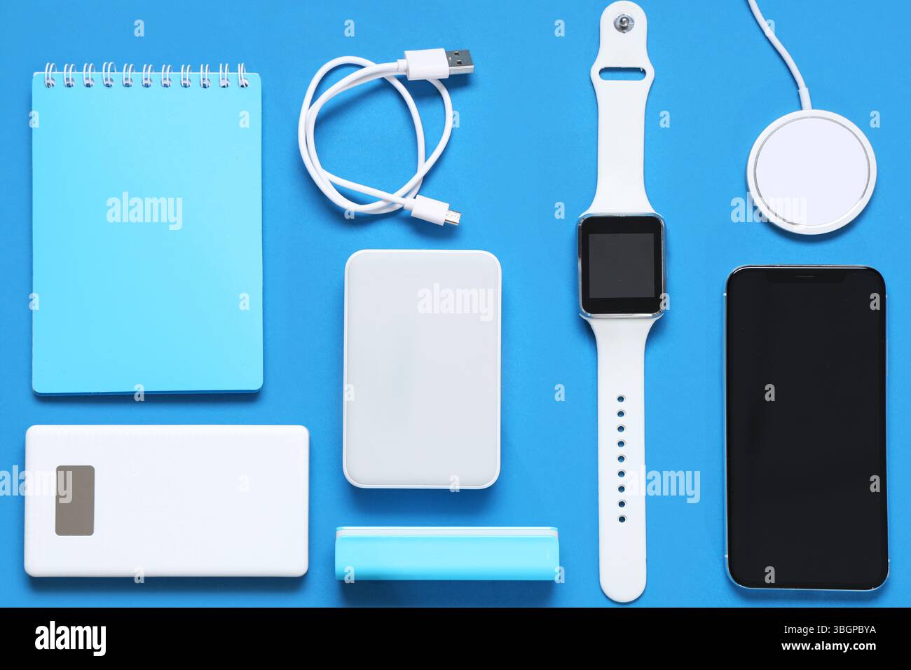 Composition with different modern gadgets and notebook on color background Stock Photo