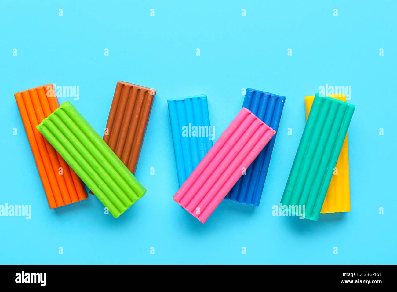 Colorful plasticine on blue background Stock Photo