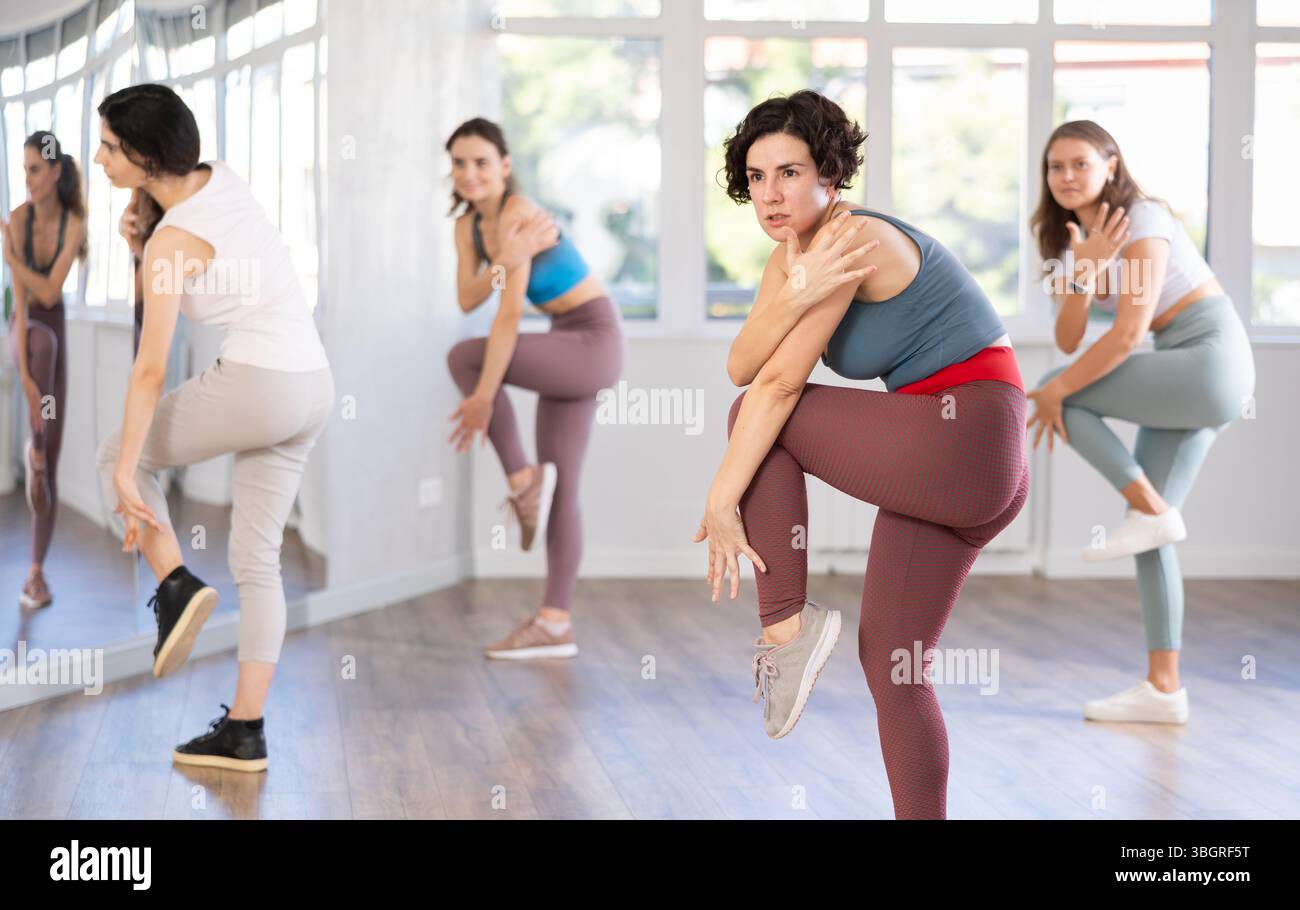 Female teacher conducts modern dance lessons for group of girls Stock ...
