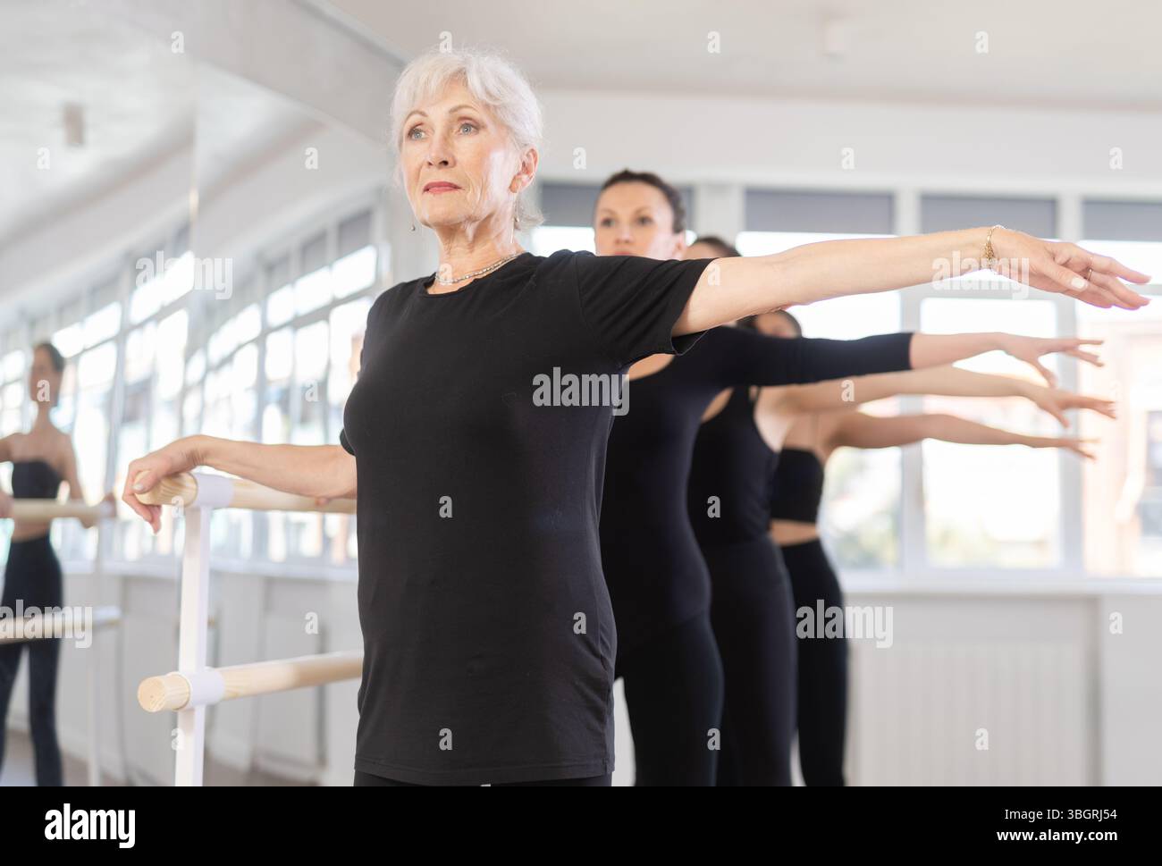 Girls in ballet class perform second position with participation of ...