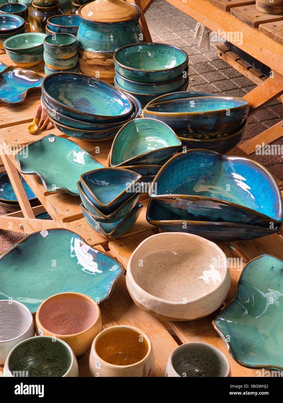 Ceramic and clay emerald colored dishes on the table. handmade - Smartphone Captured Stock Image