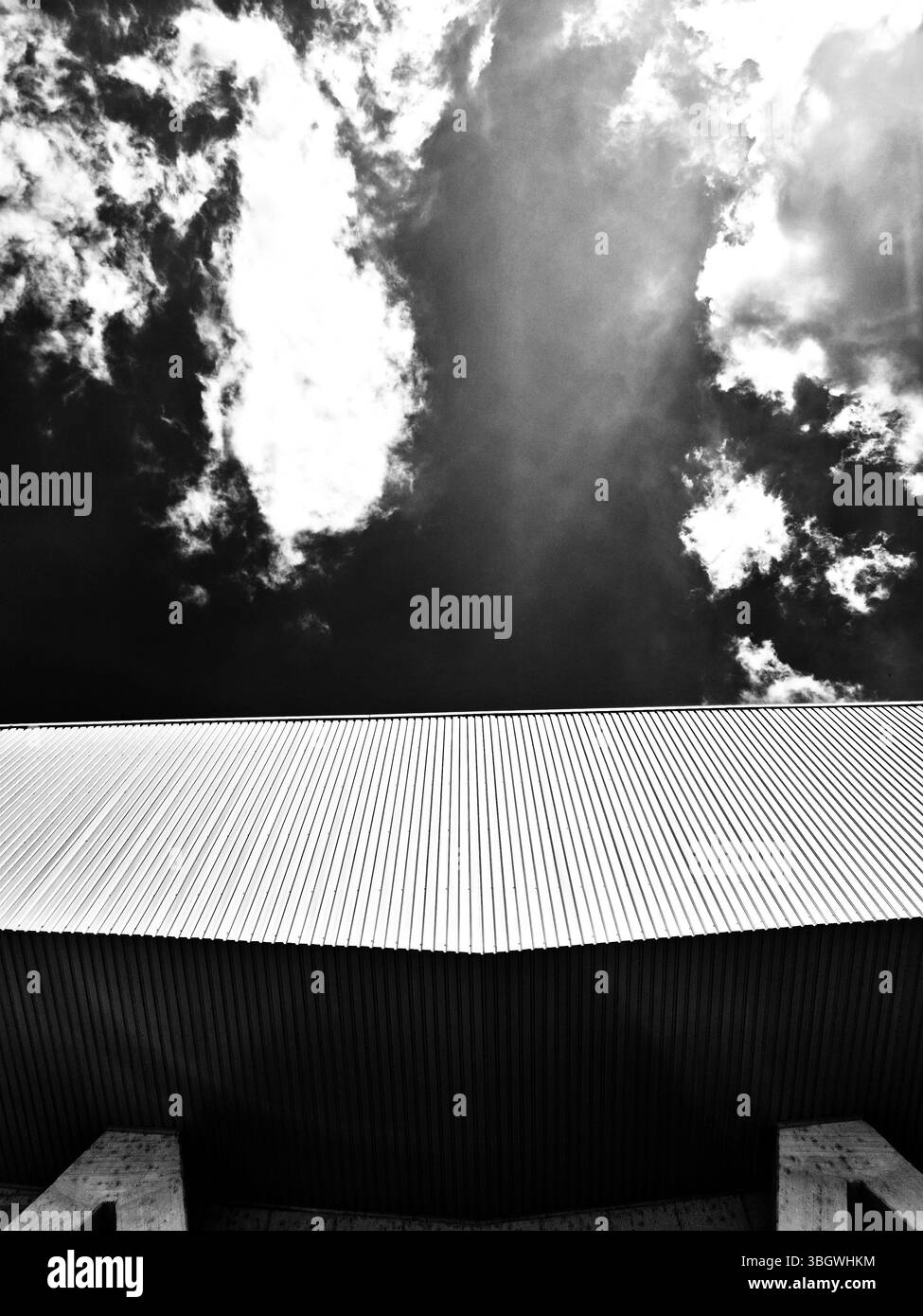 Roof of the modern building in the sky. black and white photo - Smartphone Captured Stock Image