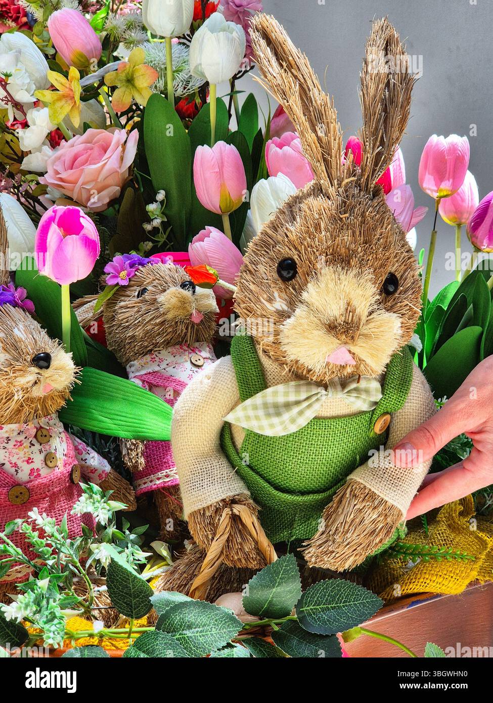 Easter bunny with flowers. Easter bunnies in a basket with flowers - Smartphone Captured Stock Image