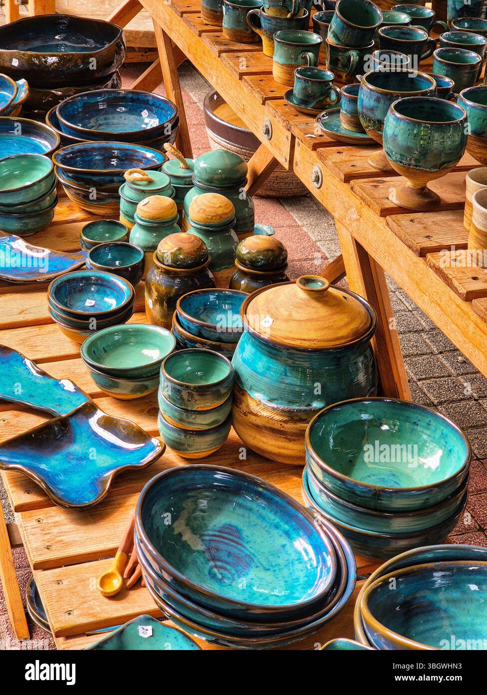 Ceramic and clay emerald colored dishes on the table. handmade - Smartphone Captured Stock Image