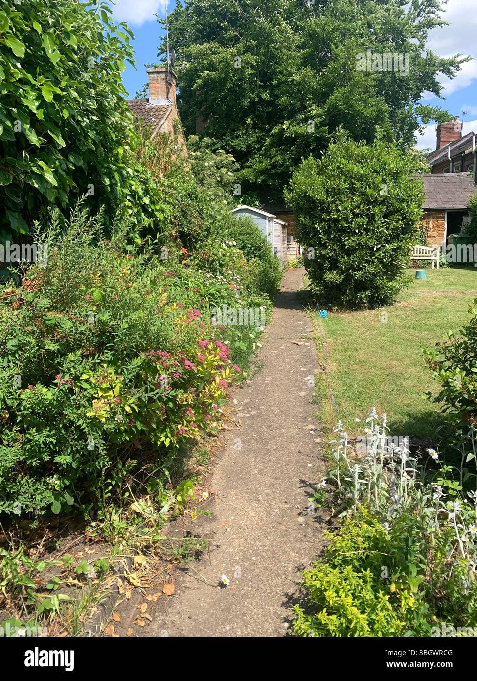 Cottage in Harpole Northampton Northamptonshire stone building small old history historic place building ancient residence Faulkner family home garden - Smartphone Captured Stock Image