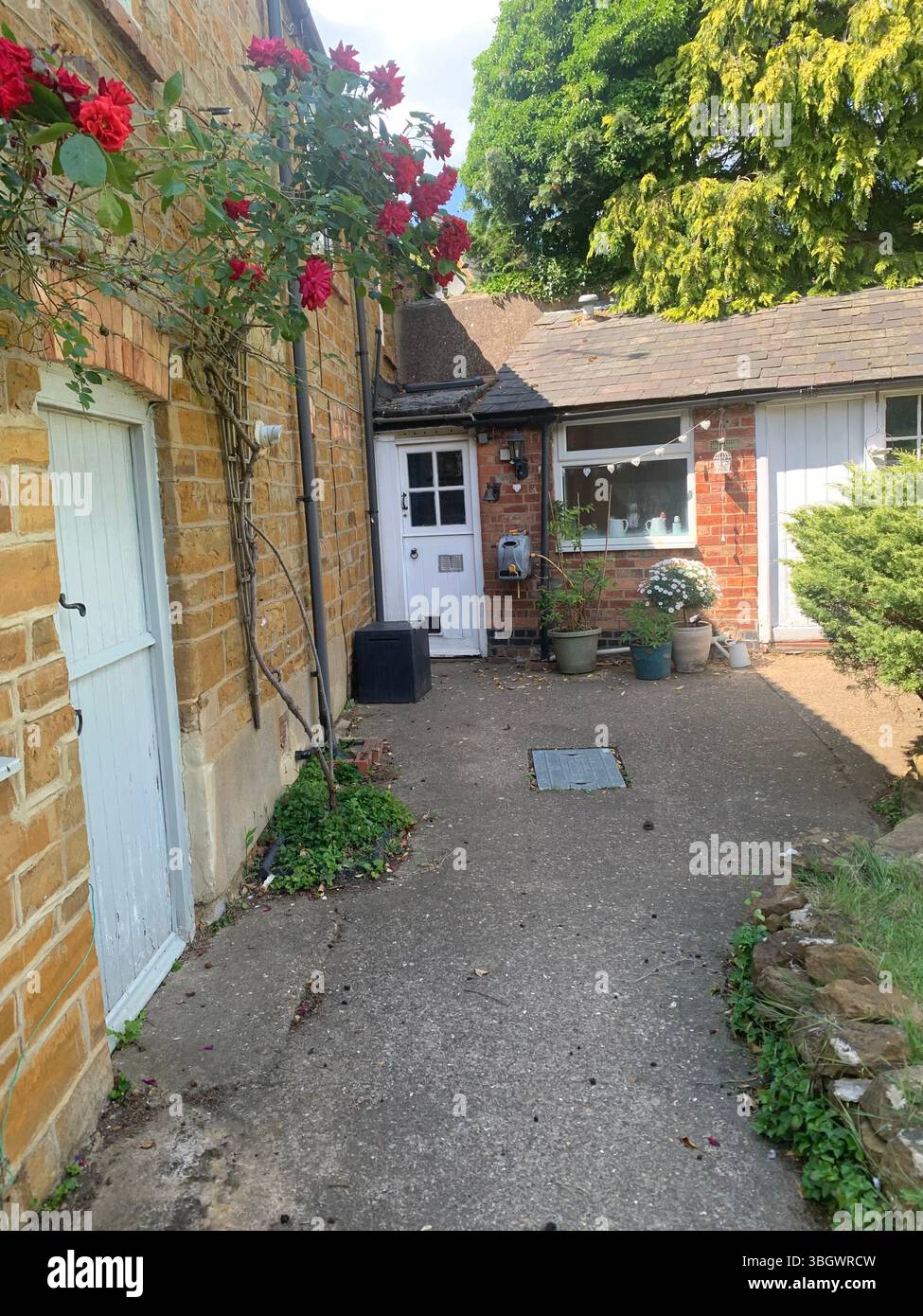 Cottage in Harpole Northampton Northamptonshire stone building small old history historic place building ancient residence Faulkner family home garden - Smartphone Captured Stock Image