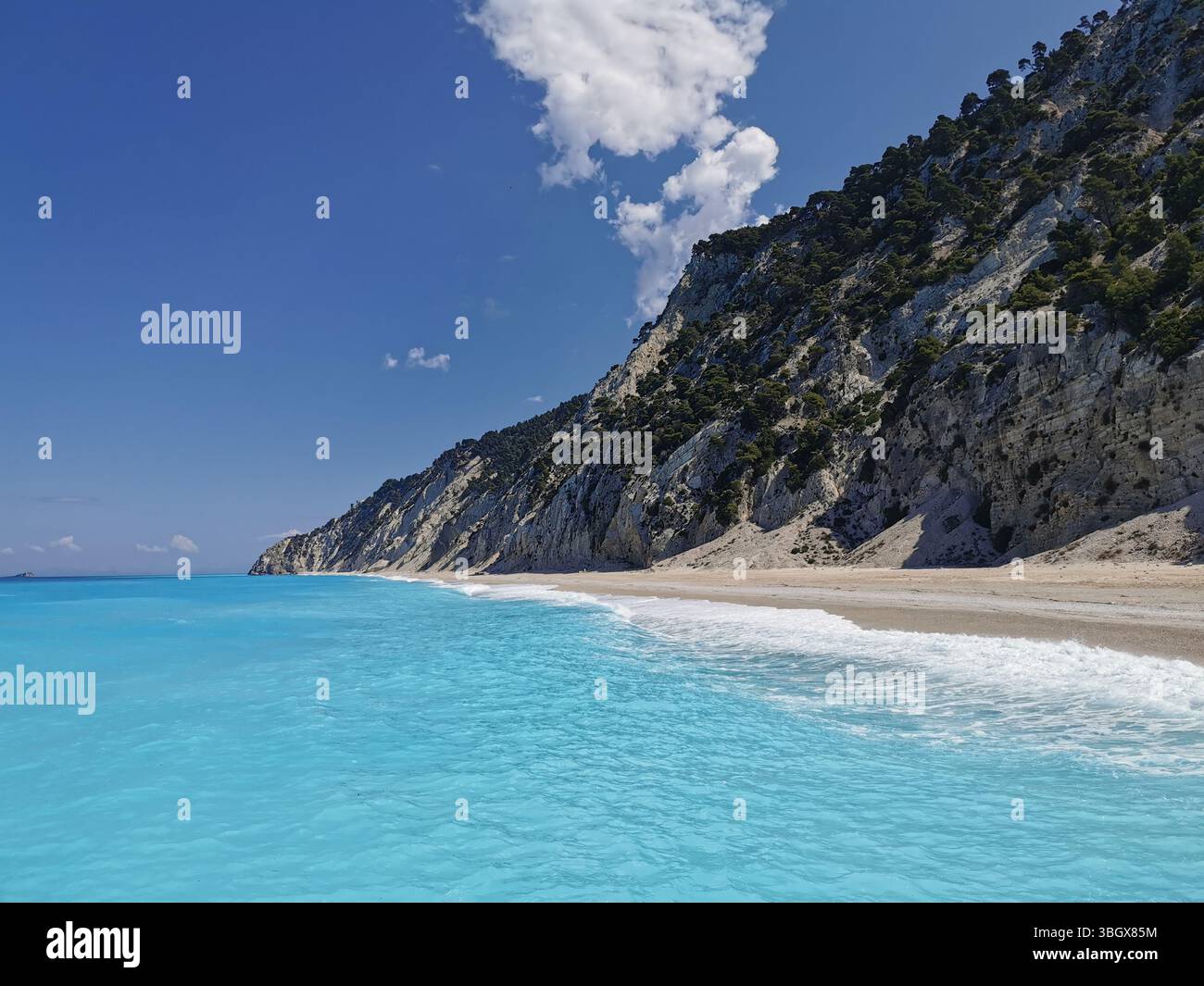The white cliffs and turquoise waters of Egremni beach on the western side of Lefkada island in Greece. This stunning area can only be reached by boat. - Smartphone Captured Stock Image
