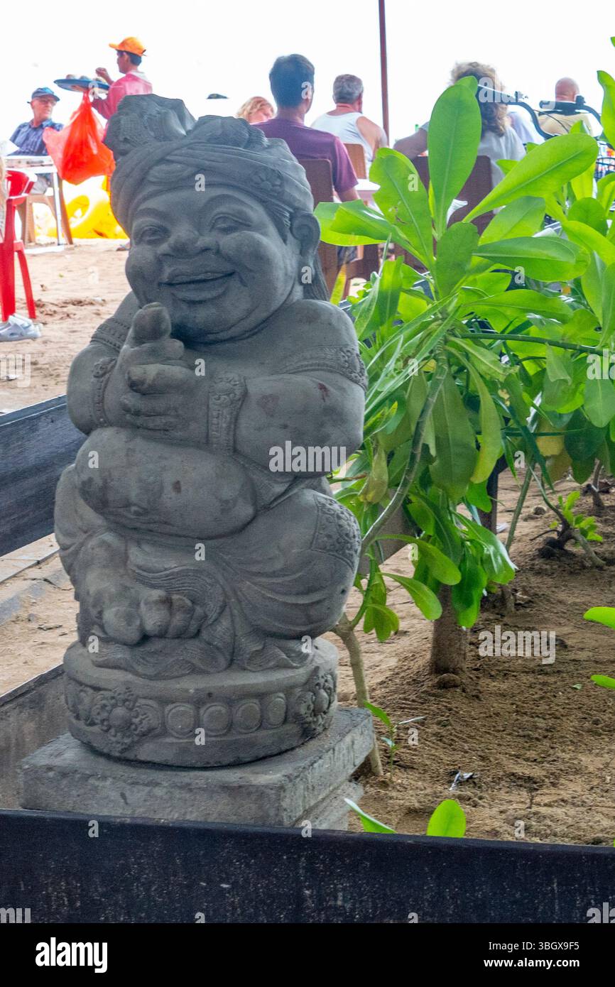 Bali, Indonesia - Dec 17, 2024: Smiling statue of a woman with a turban ...