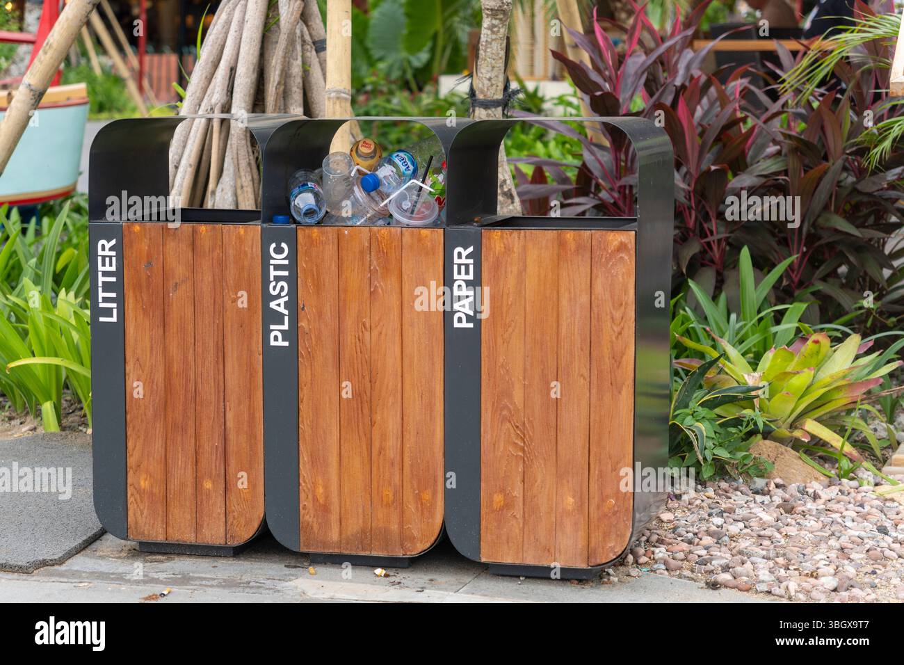 Bali, Indonesia - Dec 17, 2024: Black trash can with three bins for ...
