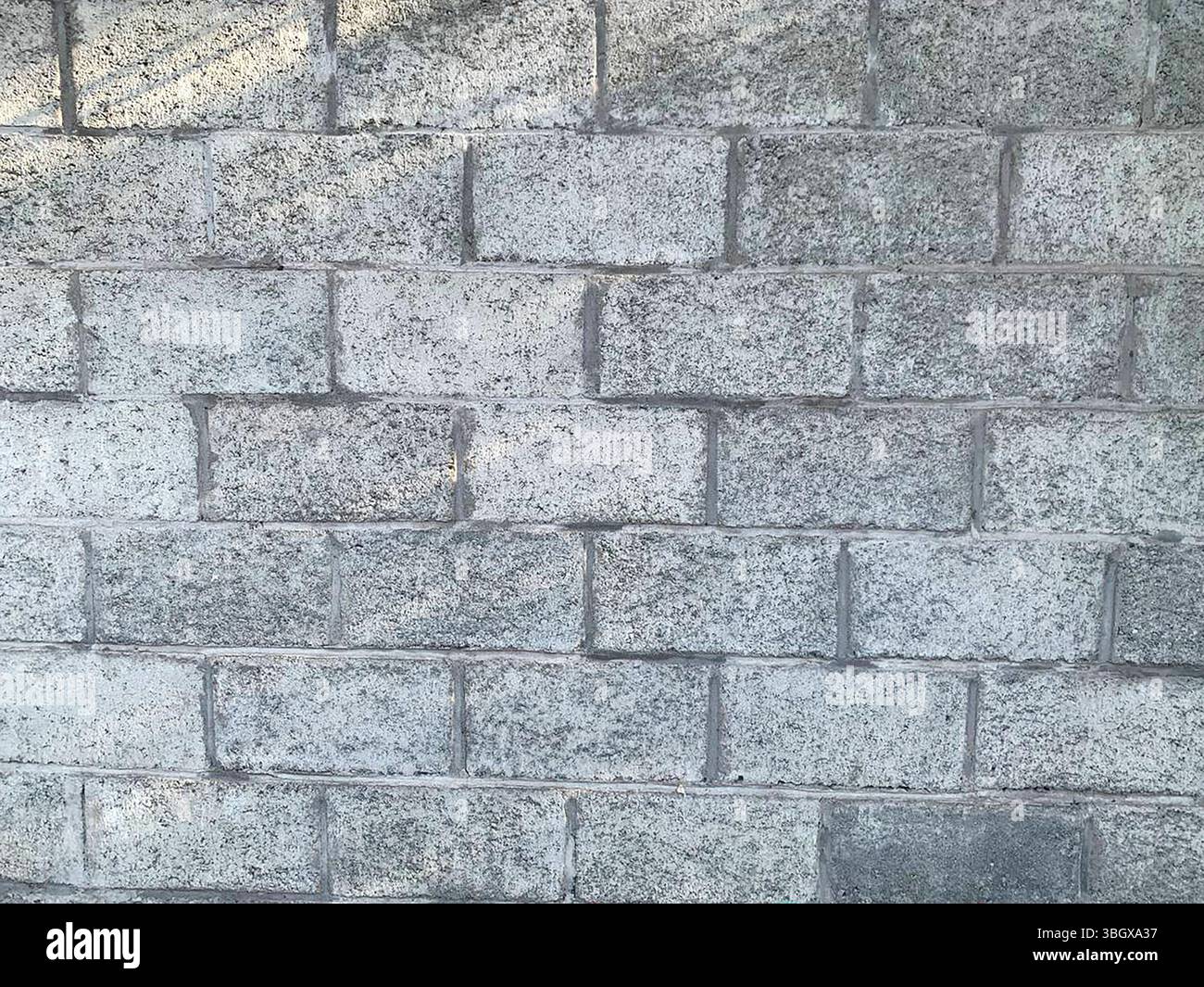 gray brick wall made of sand-cement bricks Stock Photo - Alamy