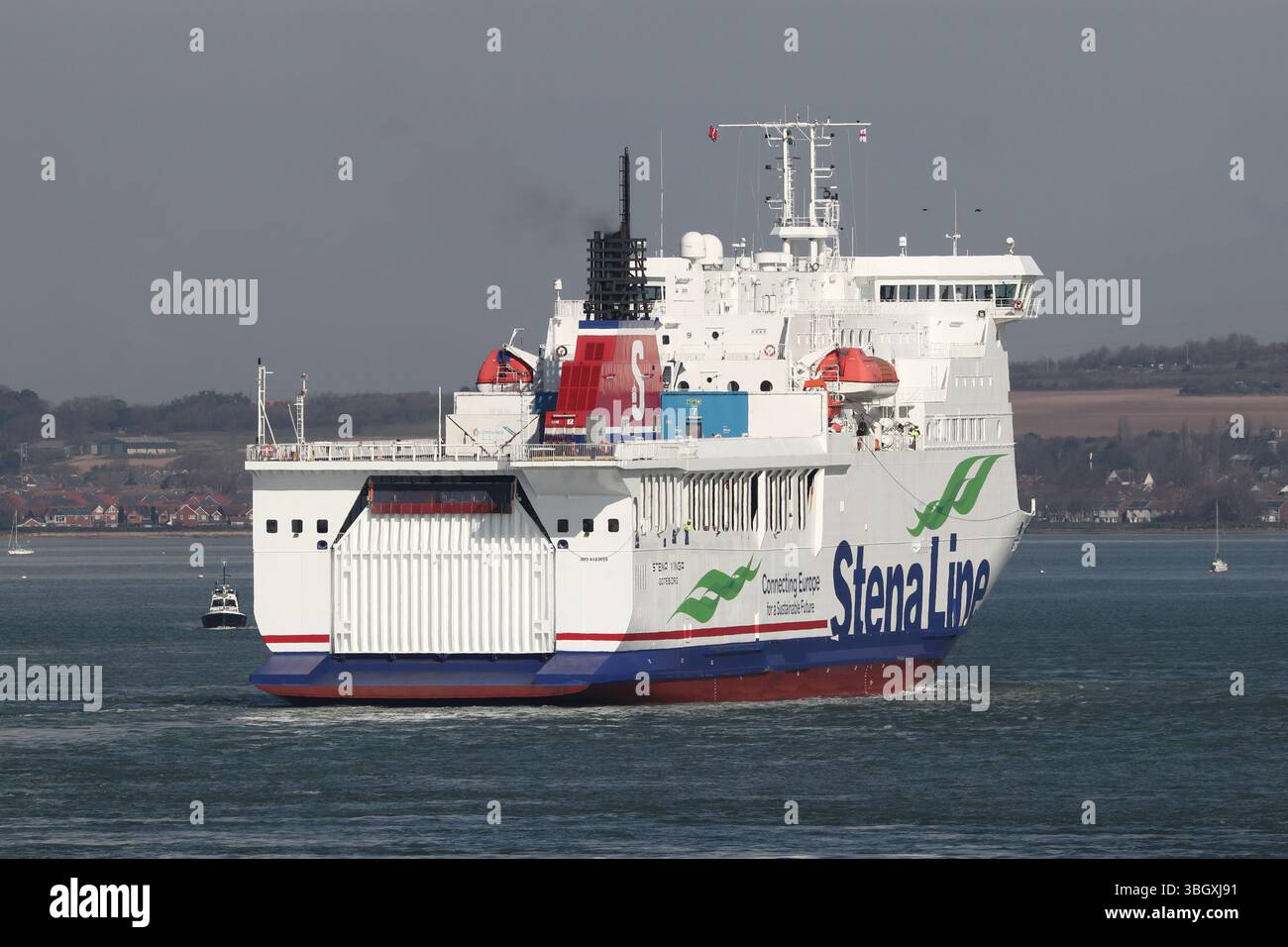 The Swedish flagged passenger and cargo ferry MV STENA VINGA heads towards the port terminal at the end of its journey from the Channel Islands Stock Photo