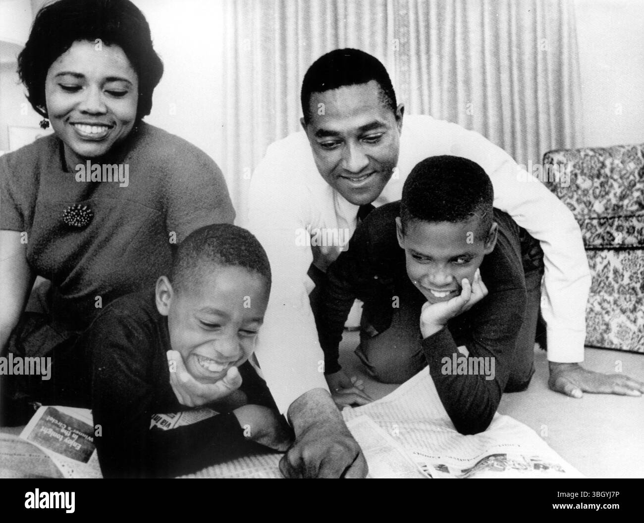 Checking the results. - Newly elected North Carolina State Representative Henry E. Frye, the first person of colour to be elected to the States general assembly in modern Tar Heal history, goes over a lecture on results with his family in their home. - 7 November 1968 Stock Photo