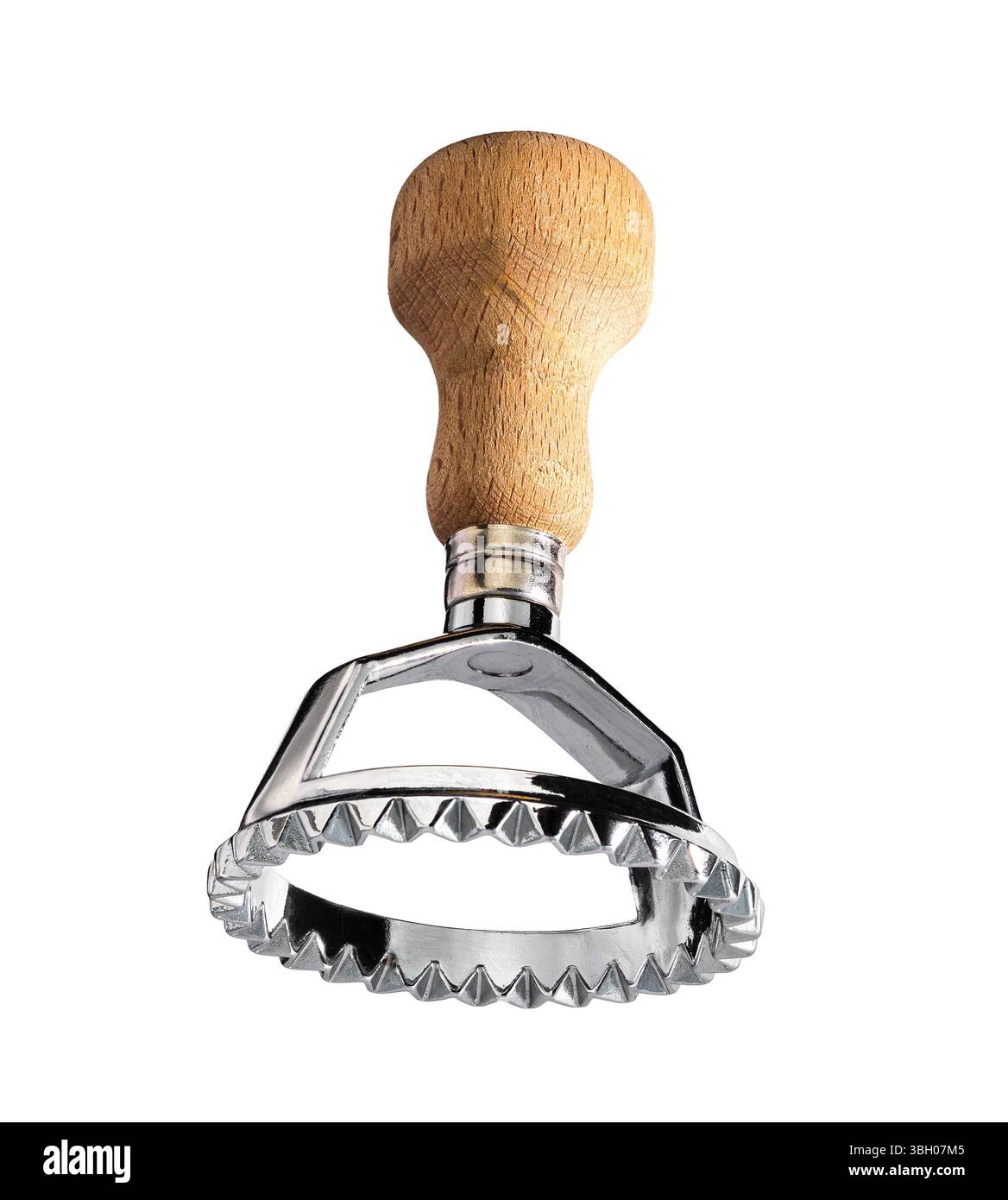 A close-up shot of a single ravioli cutter with a wooden handle and a ...