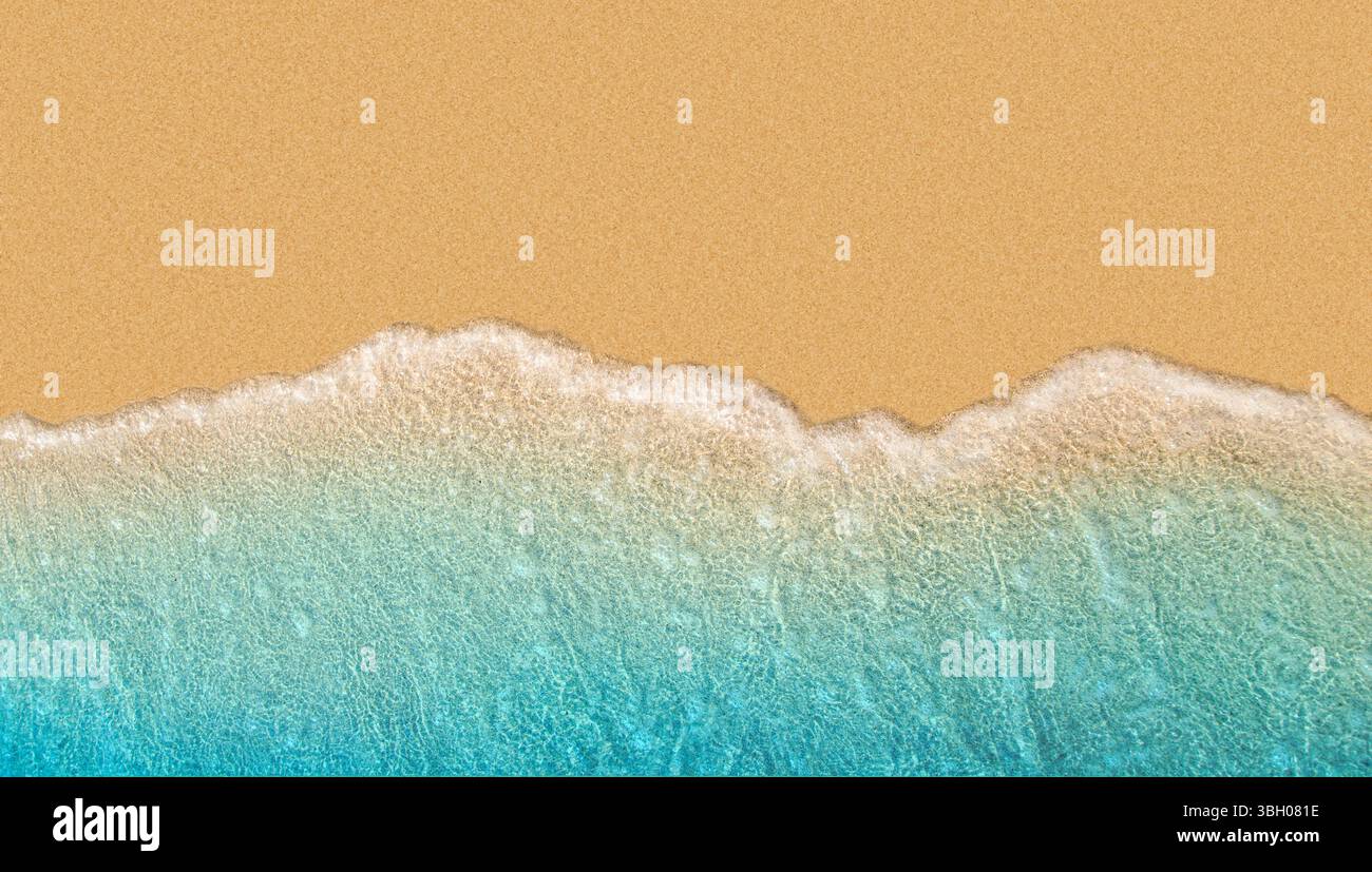 Foamy wave on sand beach Stock Photo