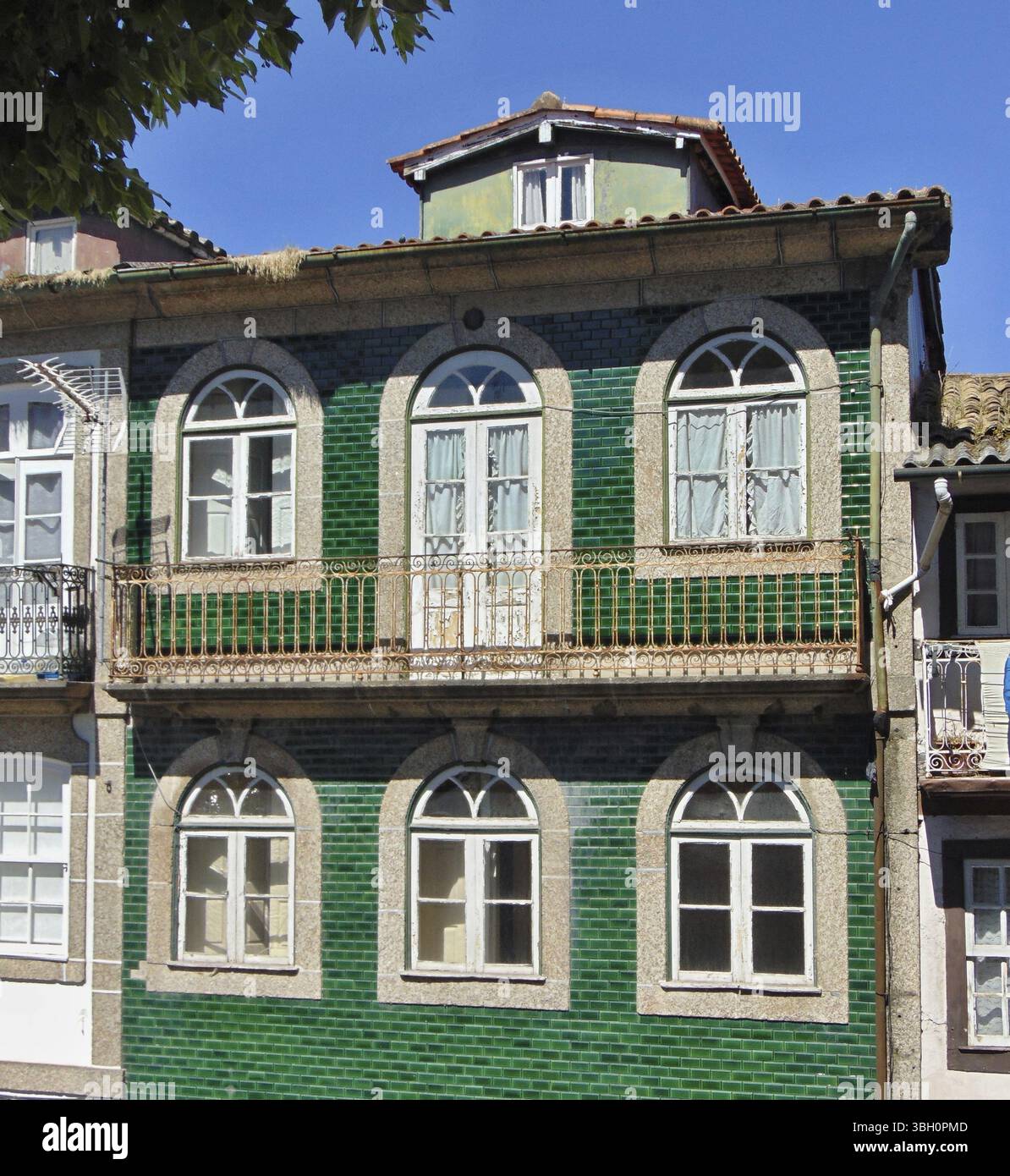 Traditional tiled facade with typical green azulejos Stock Photo - Alamy