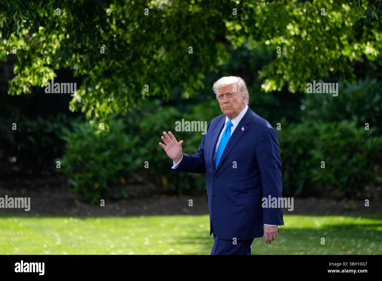 President Donald Trump walks from the Oval Office before departing on ...