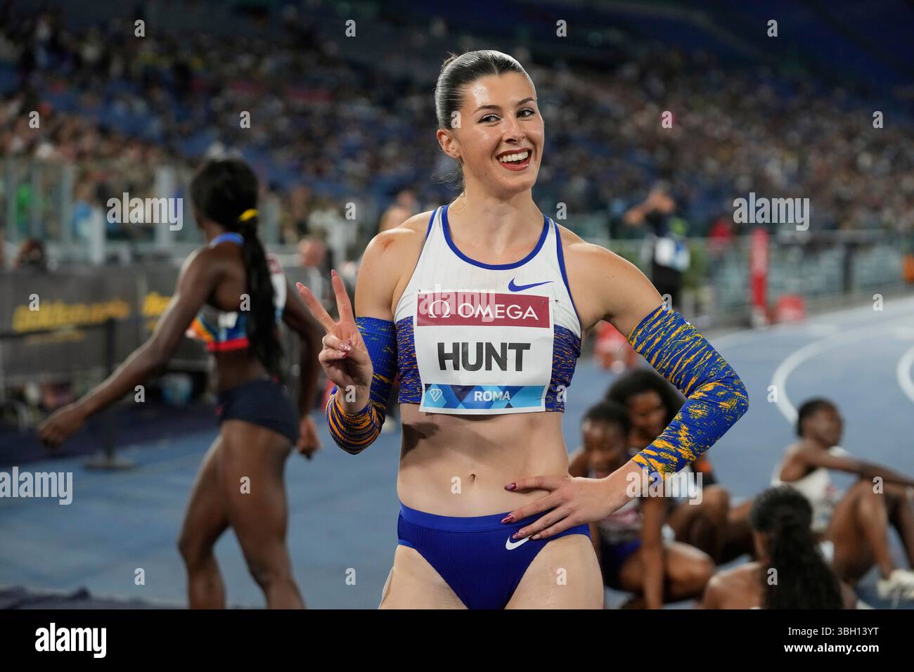 Amy Hunt, of Great Britain, poses after finishing second in the women ...