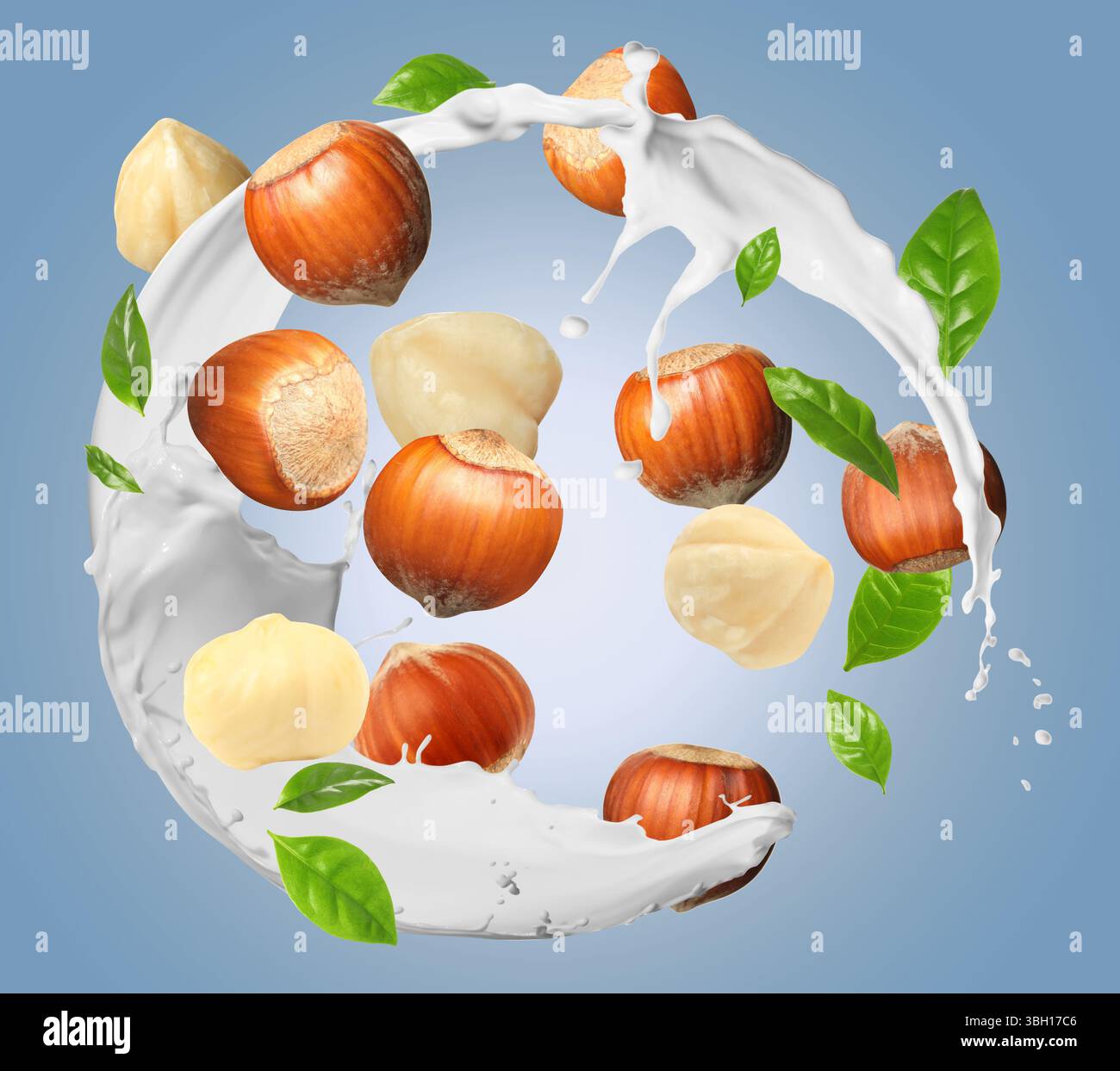 Nut milk splash with hazelnuts and green leaves in air on color gradient background Stock Photo