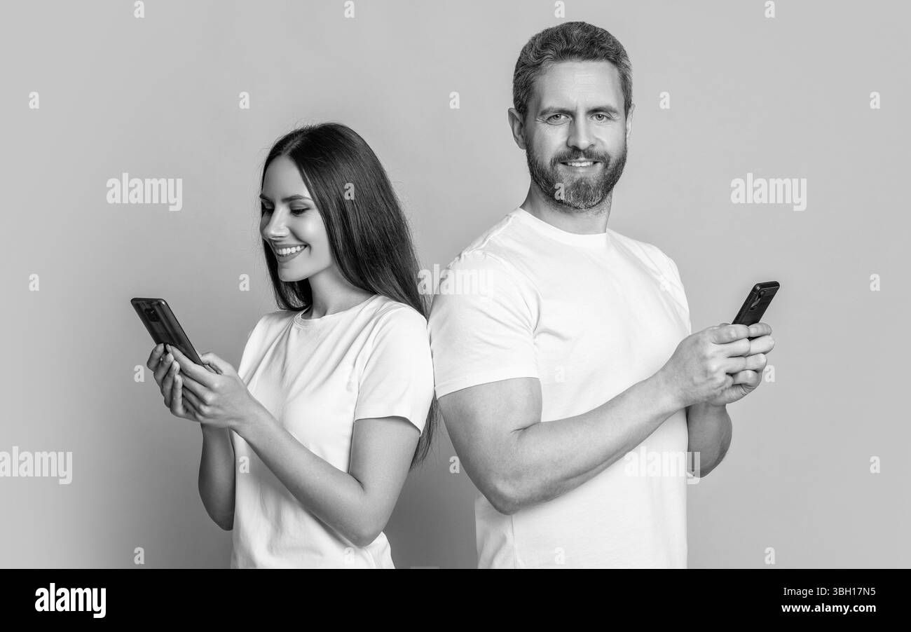 Family couple has distance relationship. Woman and man using smartphone ...