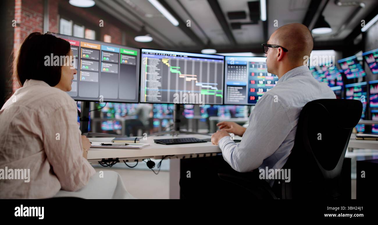 Business Analyst And Team Manage Project Schedule On Computer Screen. Stock Photo