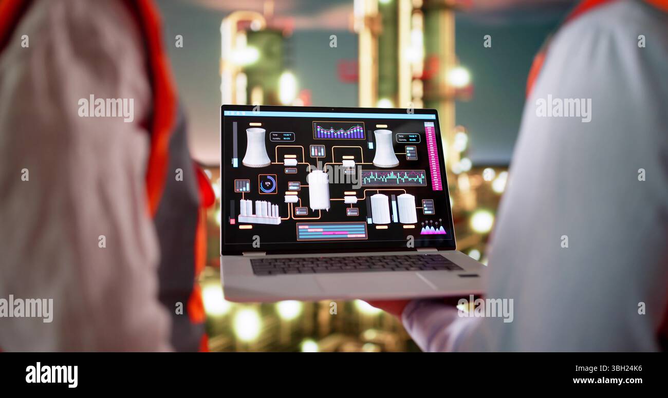 Skilled Oil And Gas Technician Analyzing Data On Computer Screens Stock Photo