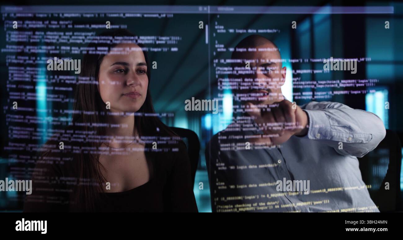 Web Coders Using Online Software On Futuristic Transparent Screen Interfaces. Stock Photo