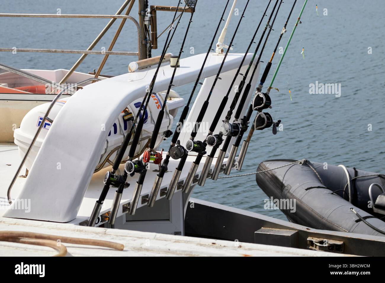 fishing rods and reels stored on a fishing charter boat blacksod county mayo republic of ireland Stock Photo