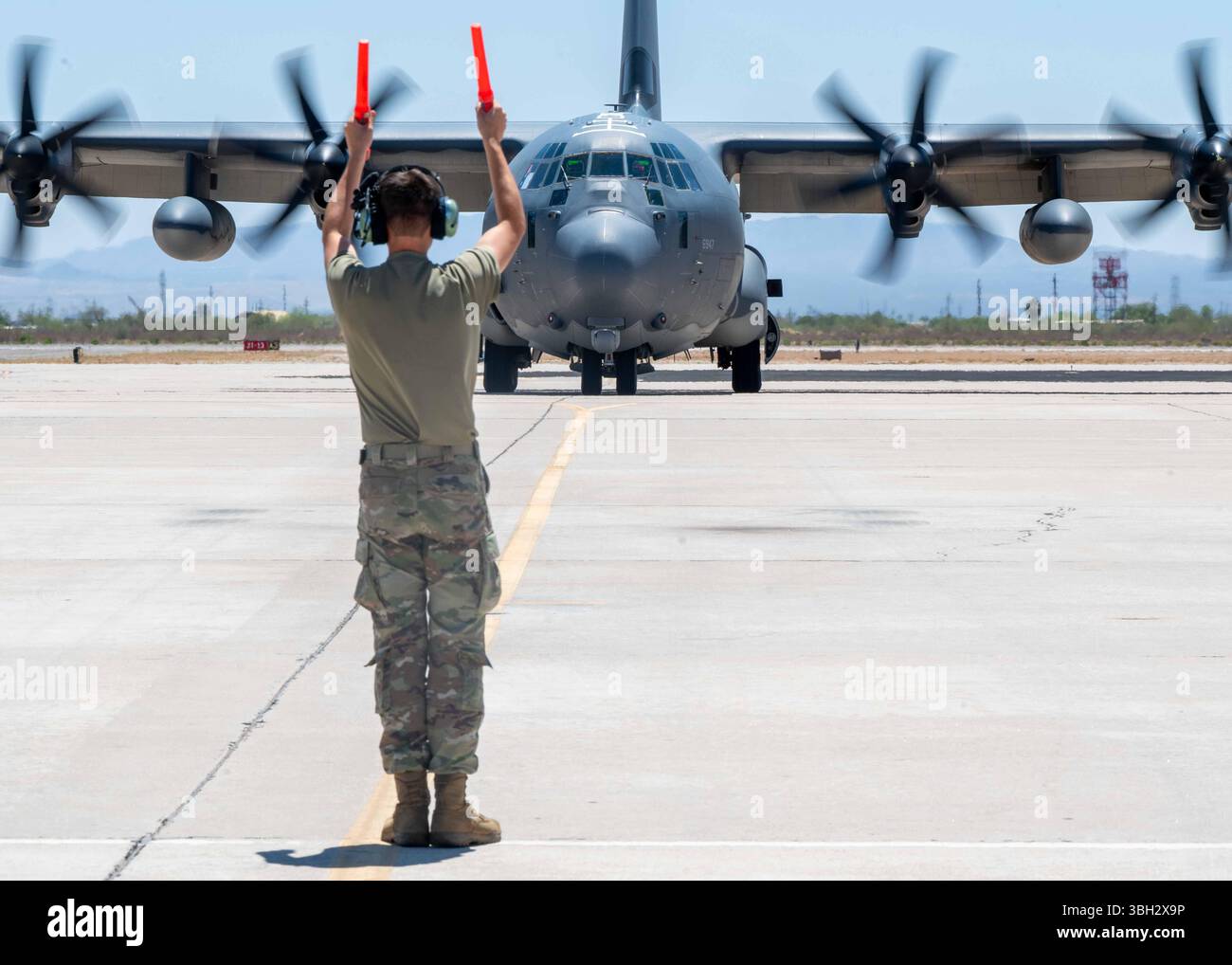 A U.S. Airman assigned to the 79th Rescue Generation Squadron marshals ...