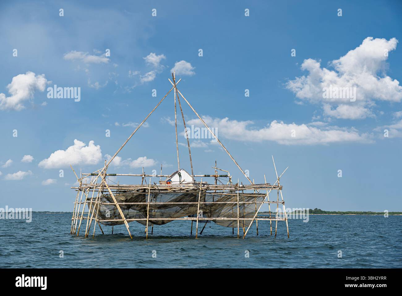 Scenic landscape view of traditional bamboo fishing platform with net, off Karangatu, Banten, West Java, Indonesia Stock Photo