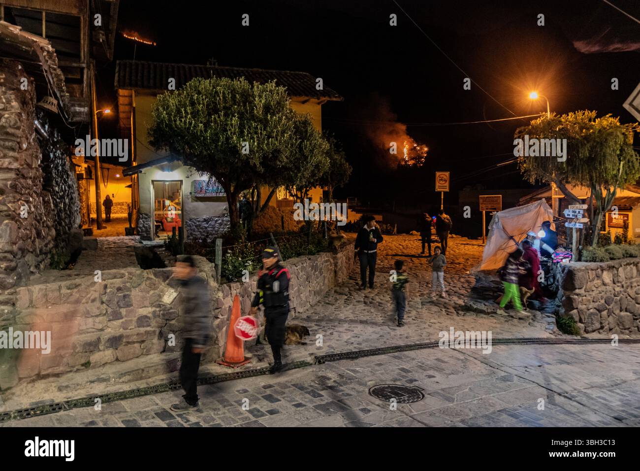 OLLANTAYTAMBO, PERU - NOVEMBER 7, 2022: Wildfire at the mountain above Ollantaytambo village, Peru. Stock Photo
