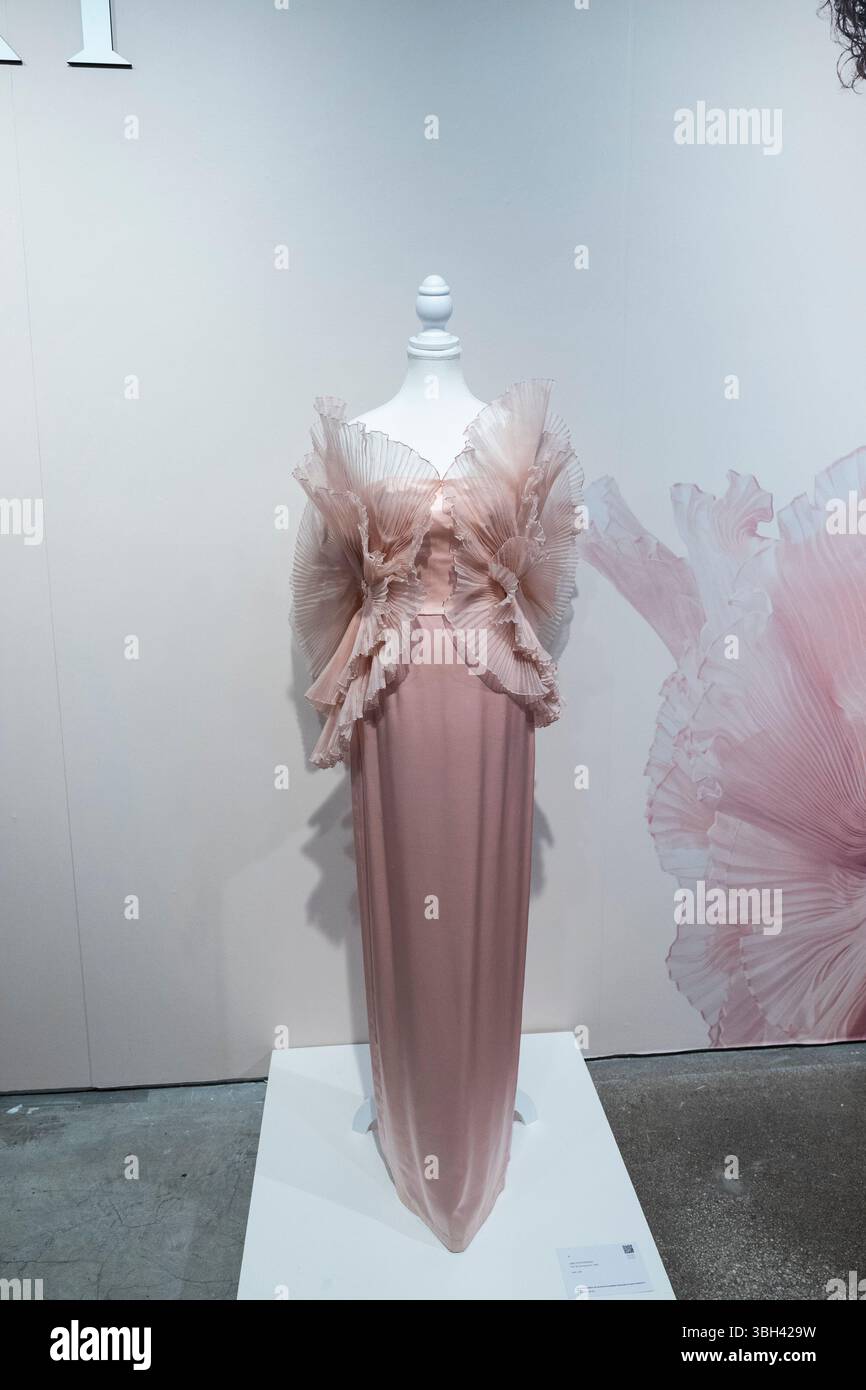 New York, United States. 06th June, 2025. Pink silk evening gown by Saks  5th Avenue on display during press preview for upcoming Luxury Week at  Sotheby's in New York on June 6,