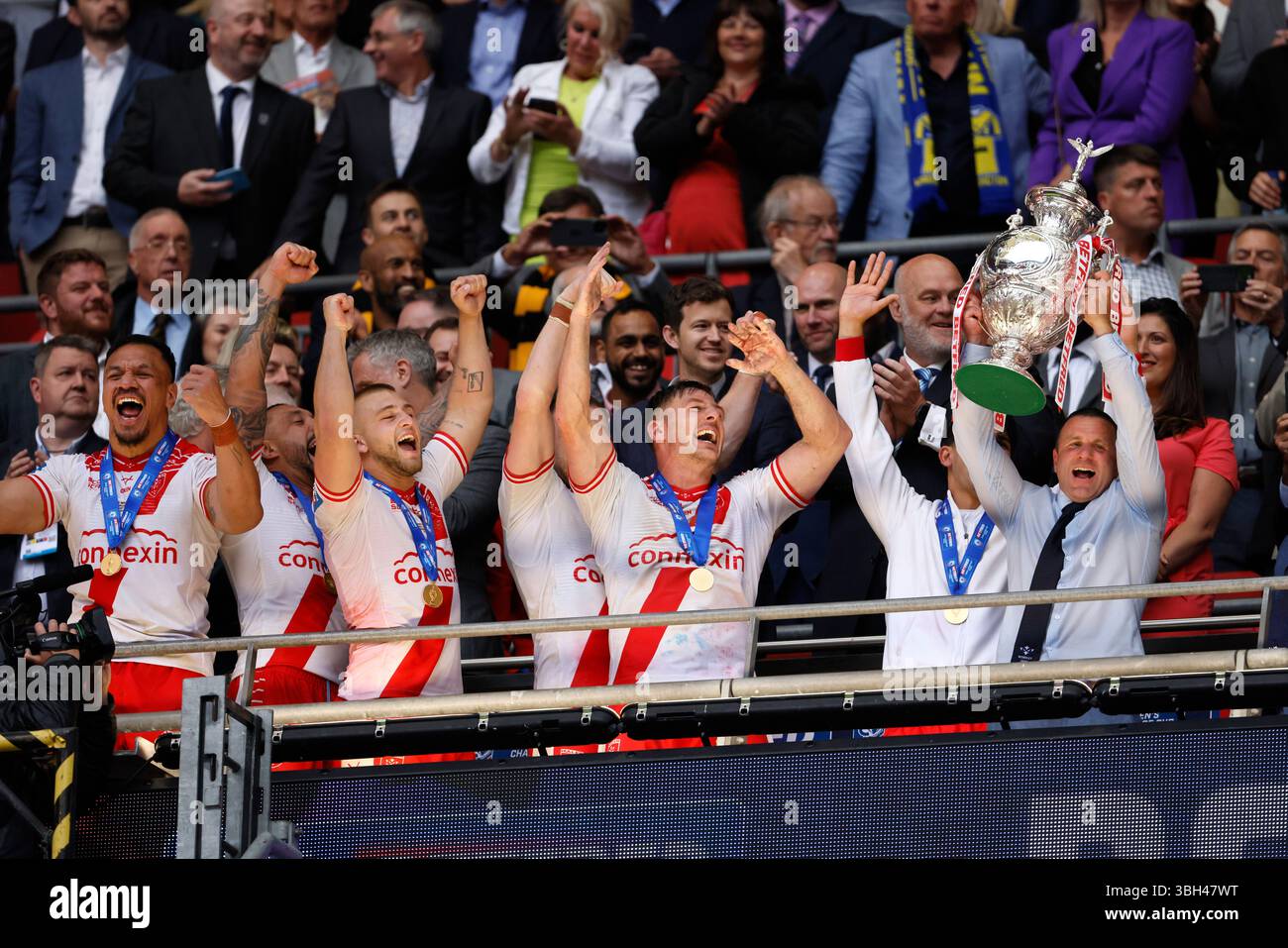 Hull Kingston Rovers’ head coach Willie Peters (right) lifts the trophy ...