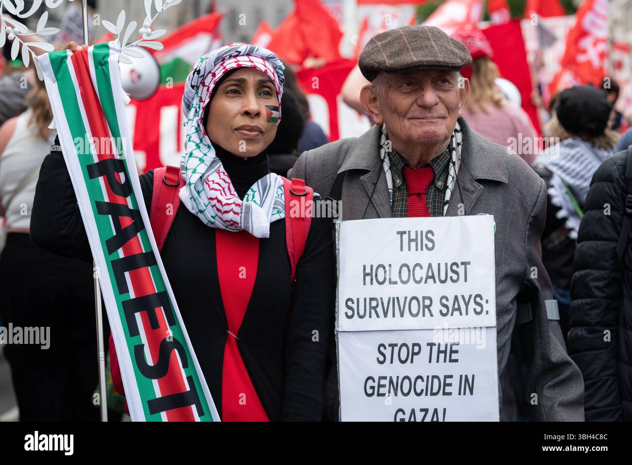 London, UK. 7 June, 2025. Holocaust survivor Stephen Kapos walks with a Muslim lady as thousands of anti-austerity protesters march to a rally in Whitehall calling for 'welfare not warfare', a reference to the recent announcement on increases to military spending, including nuclear weapons. Organised by The People's Assembly the protest came ahead of Chancellor Rachel Reeves's Spending Review and in the wake of a raft of cuts, including to disability benefits, winter fuel payments to pensioners, child benefits and housing benefits. Credit: Ron Fassbender/Alamy Live News Stock Photo