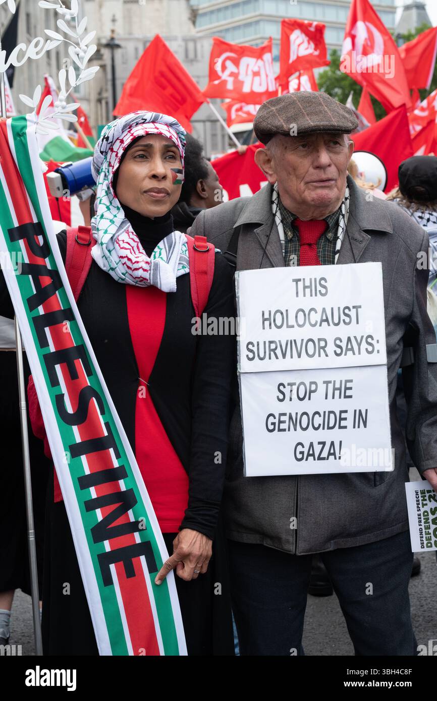 London, UK. 7 June, 2025. Holocaust survivor Stephen Kapos walks with a Muslim lady as thousands of anti-austerity protesters march to a rally in Whitehall calling for 'welfare not warfare', a reference to the recent announcement on increases to military spending, including nuclear weapons. Organised by The People's Assembly the protest came ahead of Chancellor Rachel Reeves's Spending Review and in the wake of a raft of cuts, including to disability benefits, winter fuel payments to pensioners, child benefits and housing benefits. Credit: Ron Fassbender/Alamy Live News Stock Photo