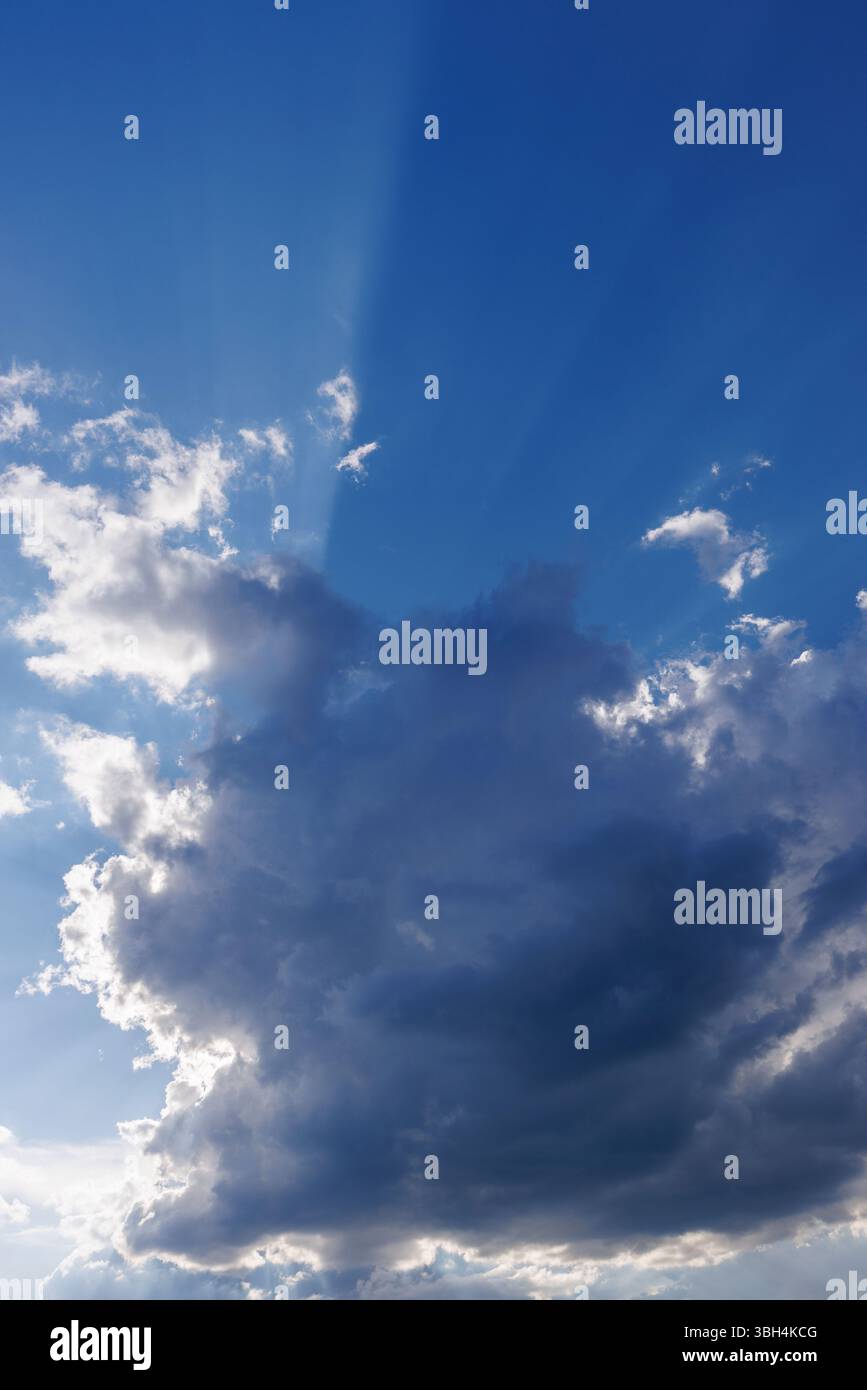 Sun glowing behind a dark cloud, Finland Stock Photo