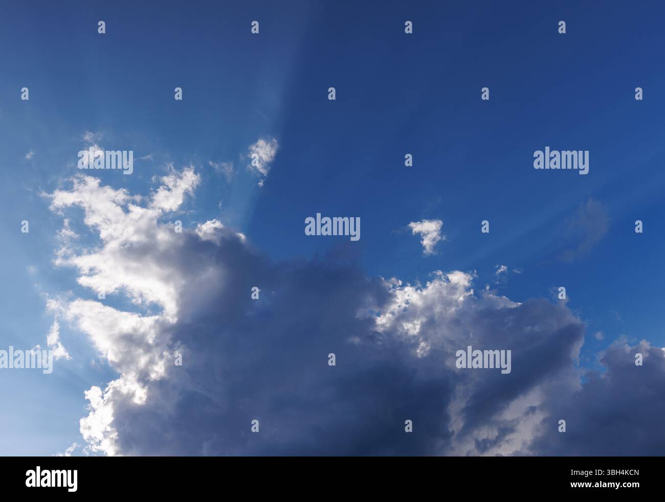 Sun glowing behind a dark cloud, Finland Stock Photo