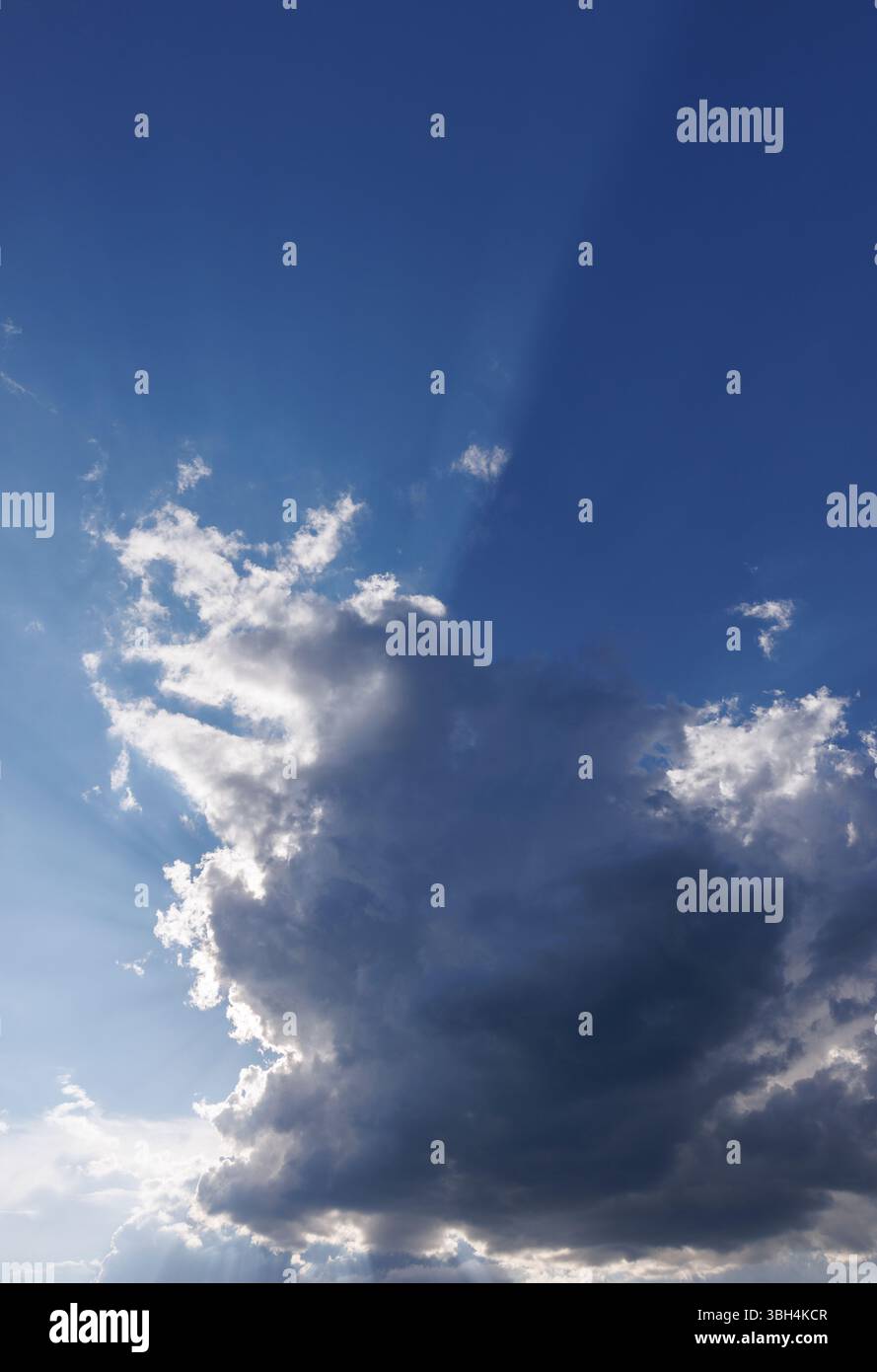 Sun glowing behind a dark cloud, Finland Stock Photo