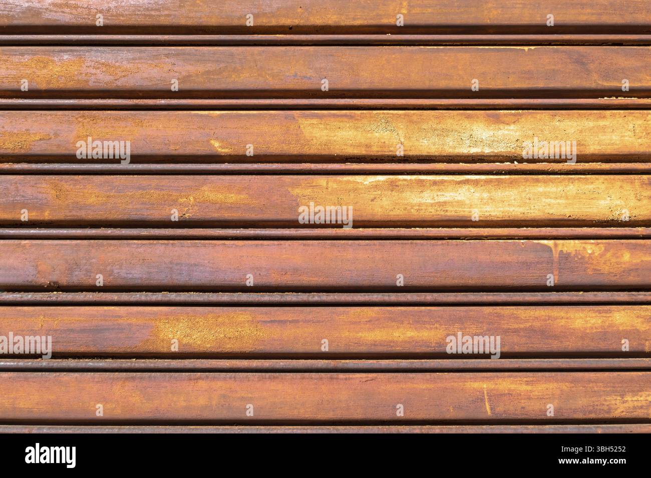 Rusty metal shutter gate. Grungy background texture Stock Photo