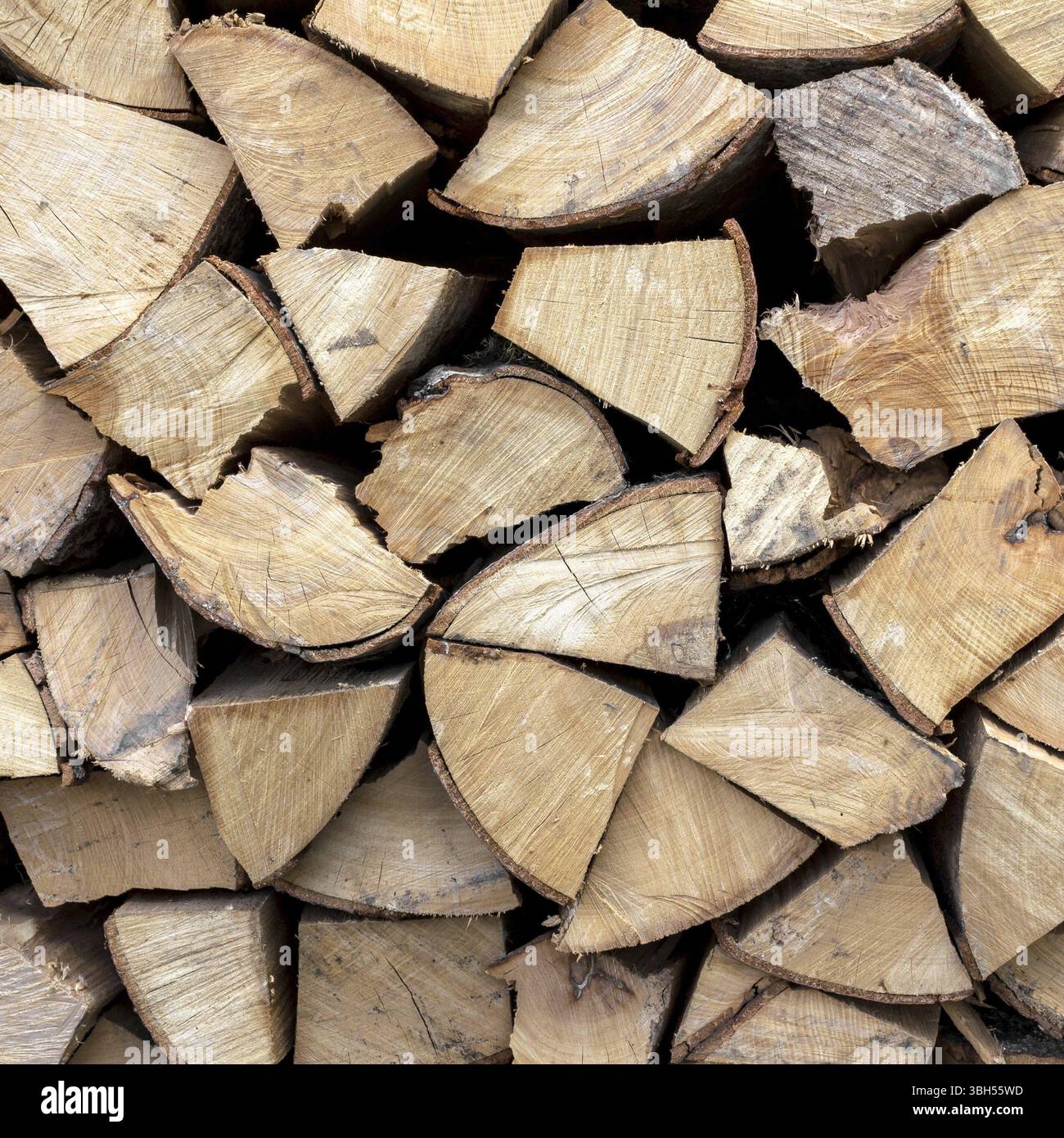 Firewood neatly stacked in the woodpile Stock Photo - Alamy