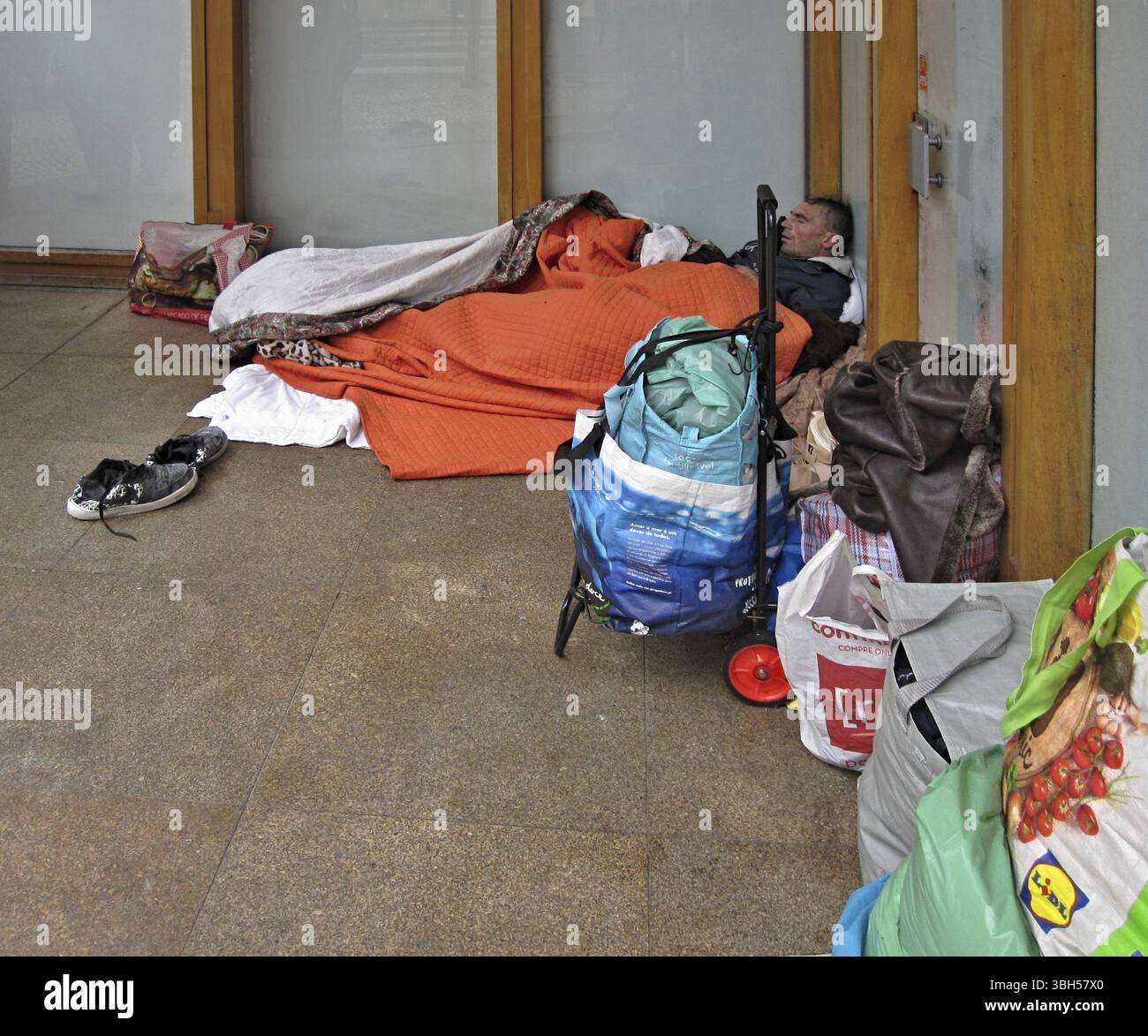 Two homeless people sleep in hi-res stock photography and images - Alamy