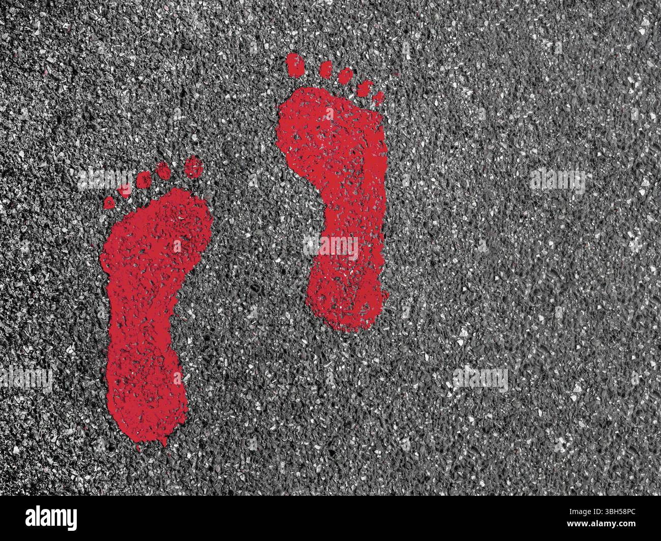 Red footprint signs on an asphalt road for pedestrian. Symbol of ...