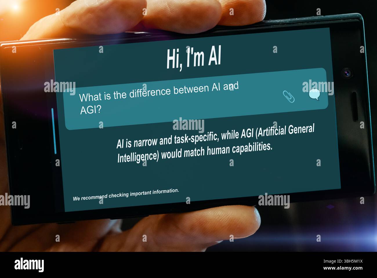 Question for AI on tablet screen. What is the difference between. AI and. AGI? Stock Photo