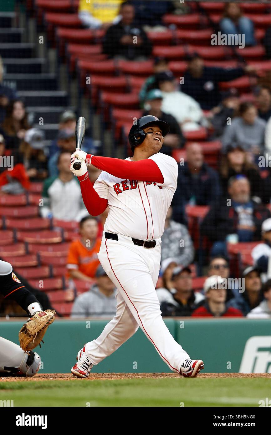 Boston Red Sox's Rafael Devers follows through on his grand slam home