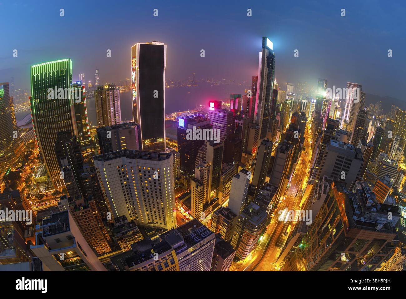 Aerial view of Hong Kong skyscrapers at night from a roof, located in ...