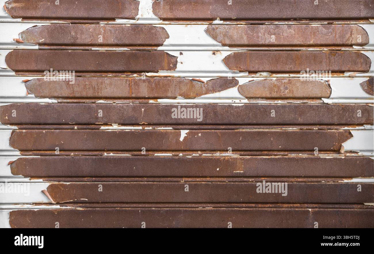 Old rusty garage shutter. Ideal for concepts and backgrounds Stock Photo