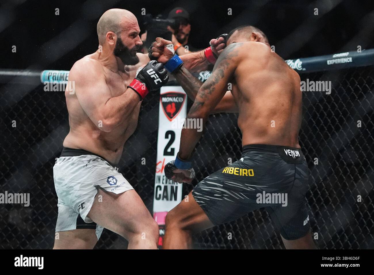 Russia's Azamat Murzakanov, left, punches Brazil's Brendson Ribeiro ...