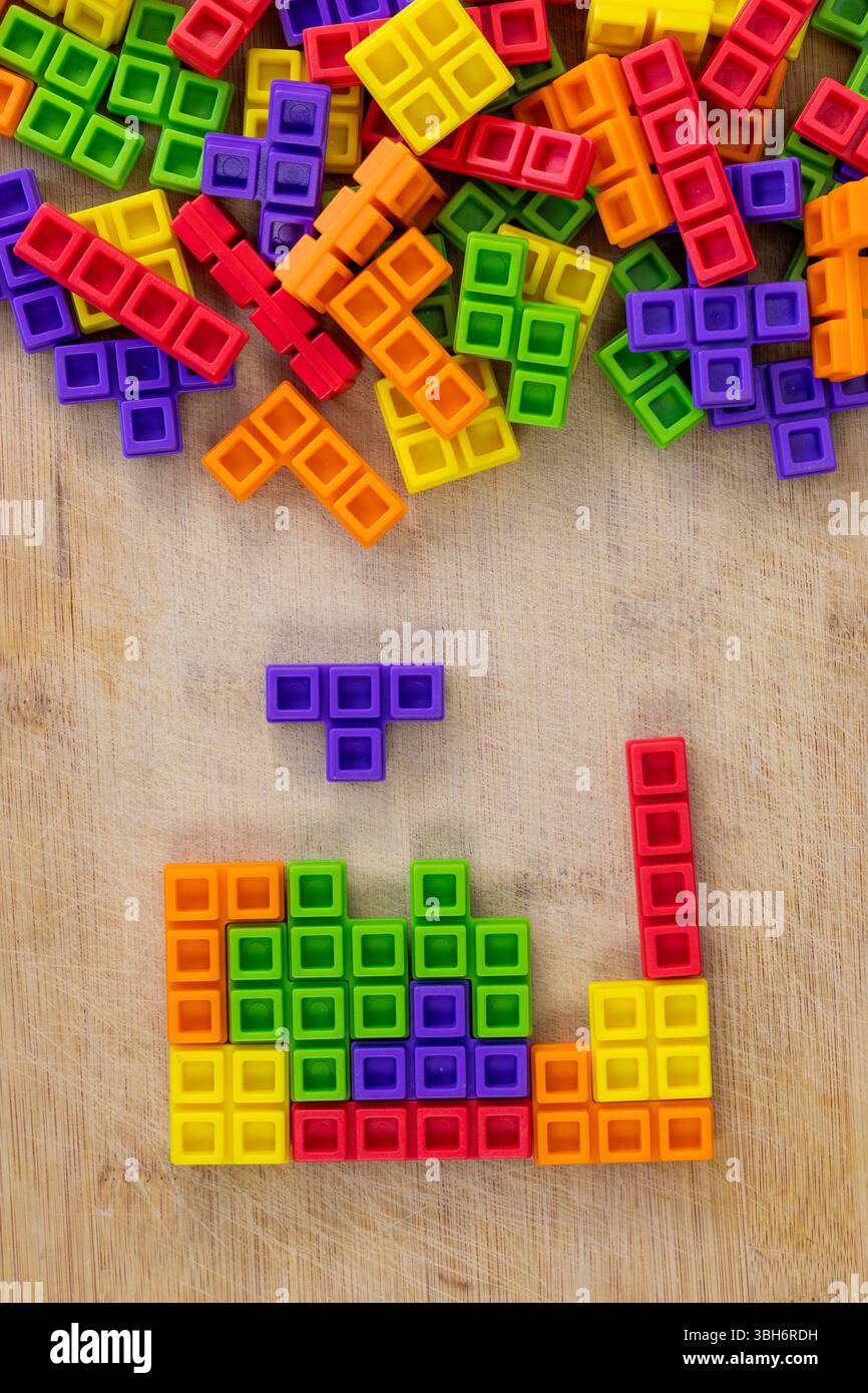 Falling Puzzle Blocks Game Simulation on Wooden Surface Background ...